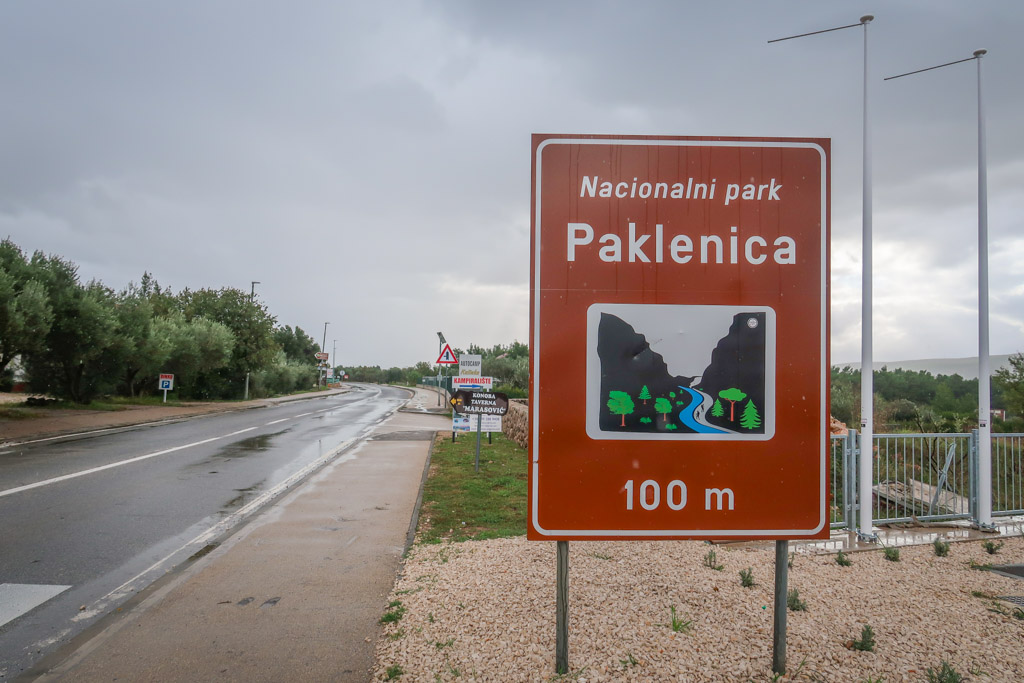 Road sign reads: Nacionali park Paklenica - 100m