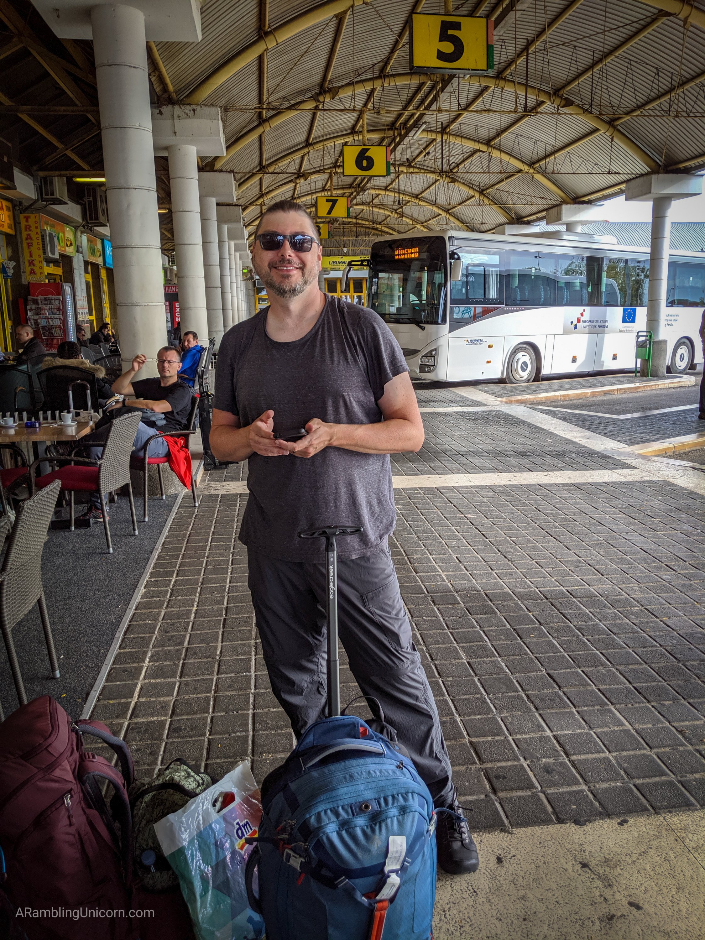 A photo of Daniel in the Zadar bus station with our bags.