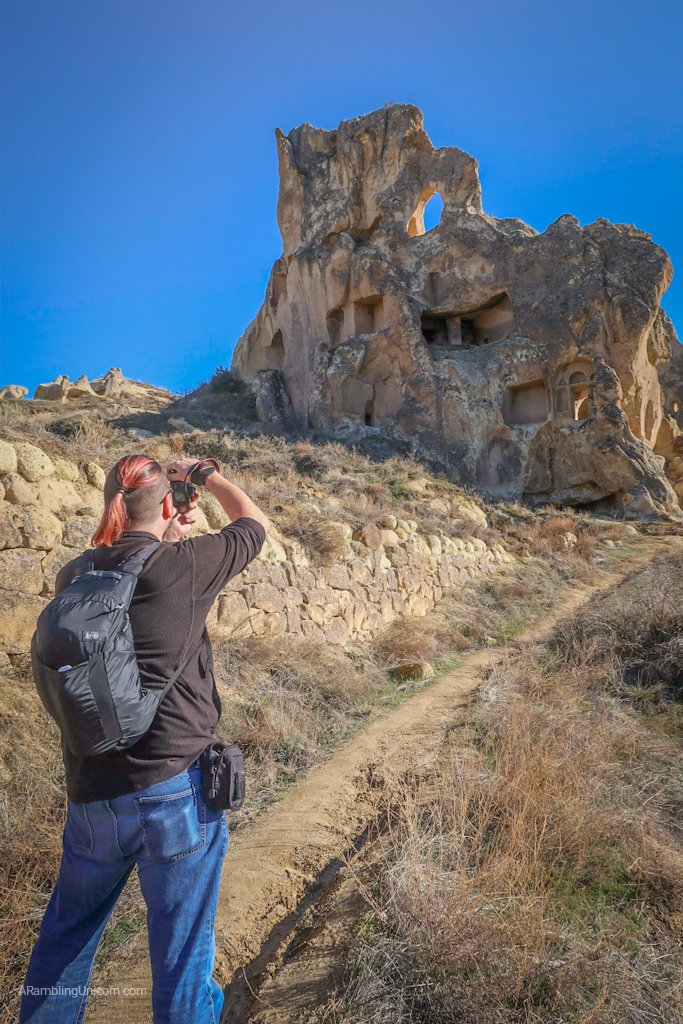Cappadocia Itinerary Day 1: Daniel takes a photo of the cave dwellings near Göreme