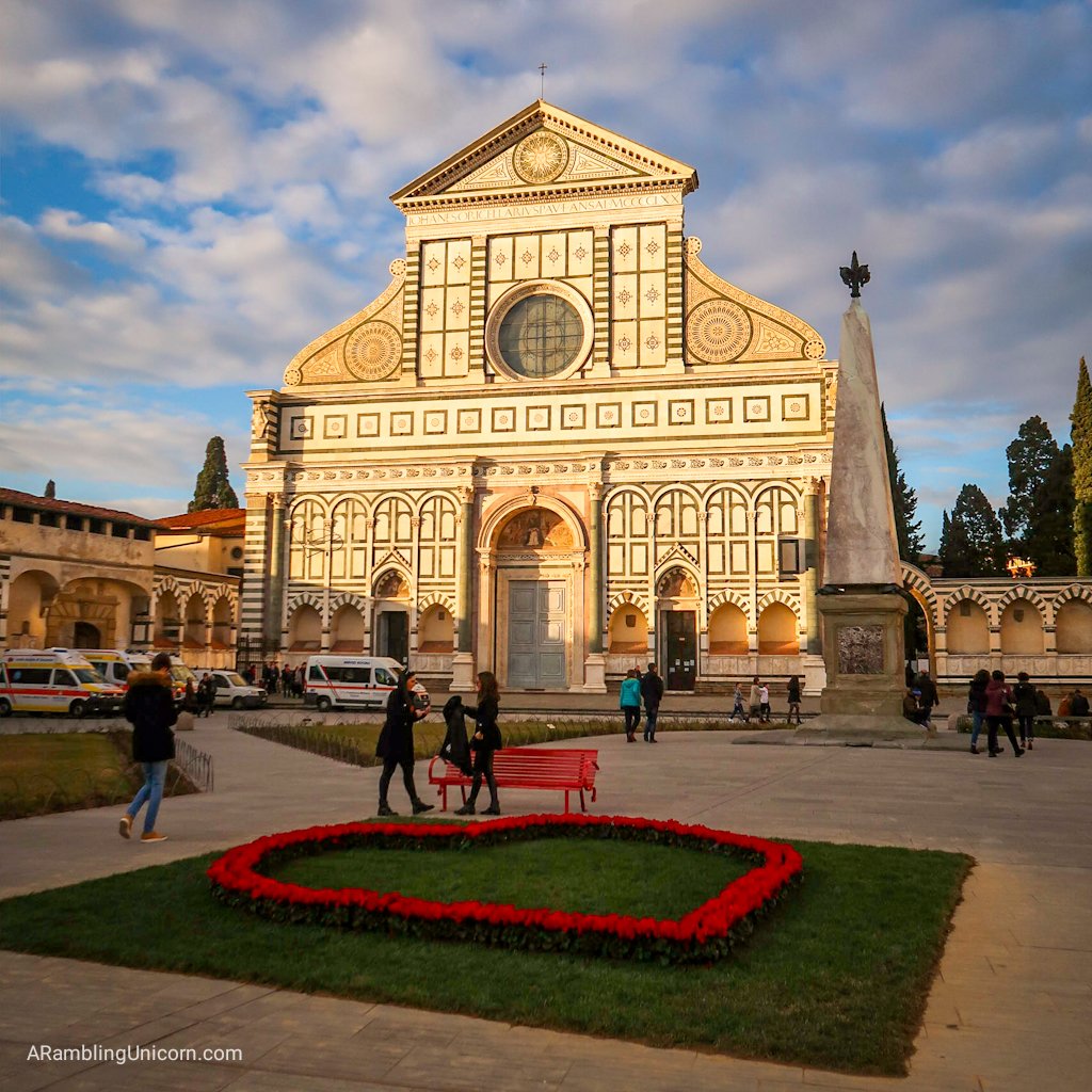 Florence 4 day itinerary: Basilica of Santa Maria Novella. Heart-shaped flowers left over from Valentine's Day decorate the Piazza.