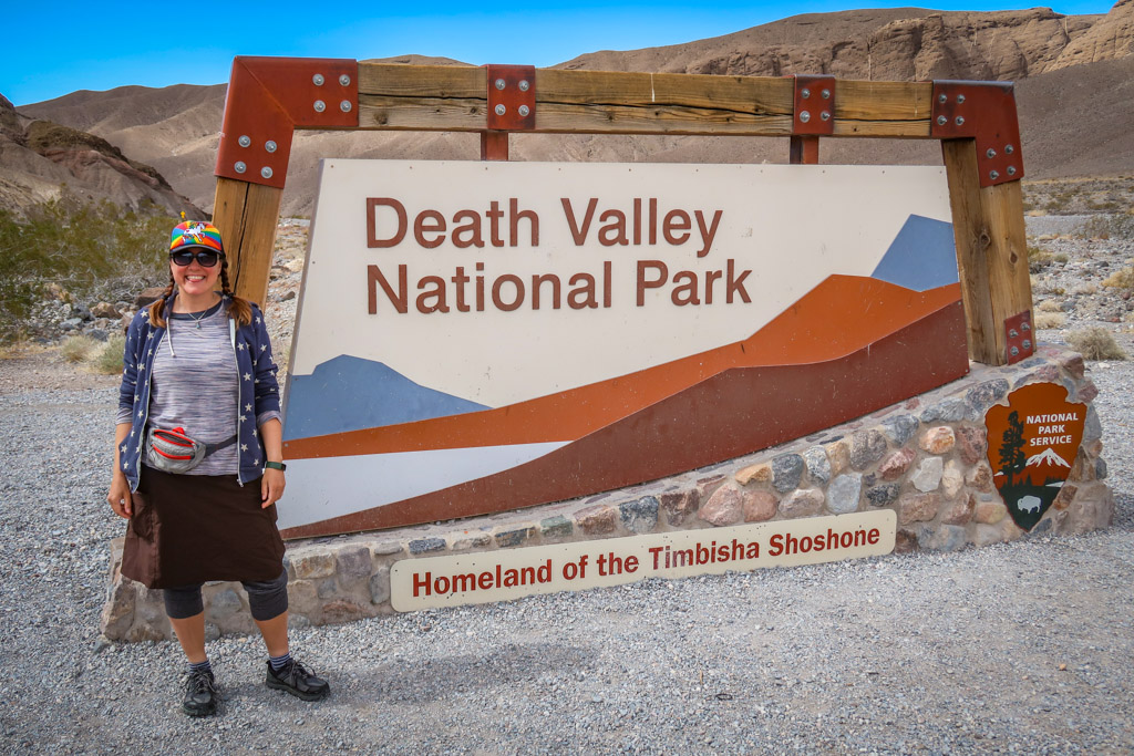 The author stands next to the Death Valley National Park entrance sign