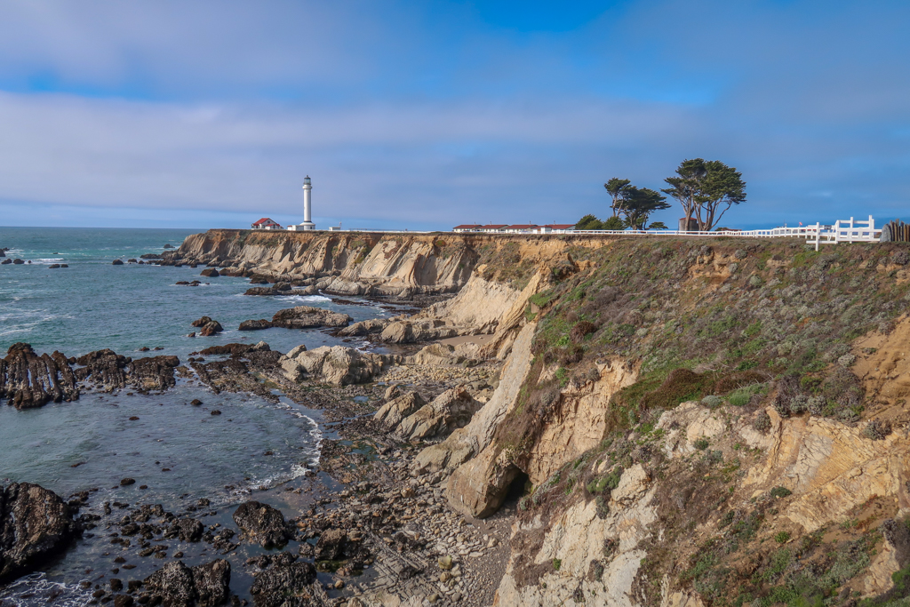 Point Arena Lighthouse stands on the end of a rocky bluff along the coast - a must-do for any Northern California Coast Road Trip