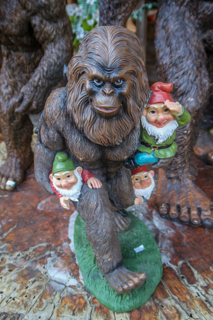 Statue of a sasquatch holding three adorable gnomes at the Legend of BigFoot gift shop.