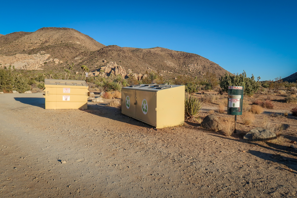 Two large garbage dumpsters and a small garbage can at the Ryan Mountain Campground.