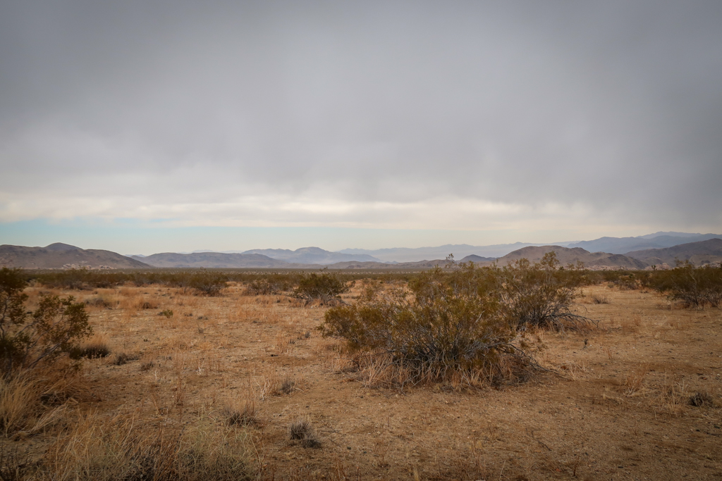 High desert landscape with dark cloudy skies