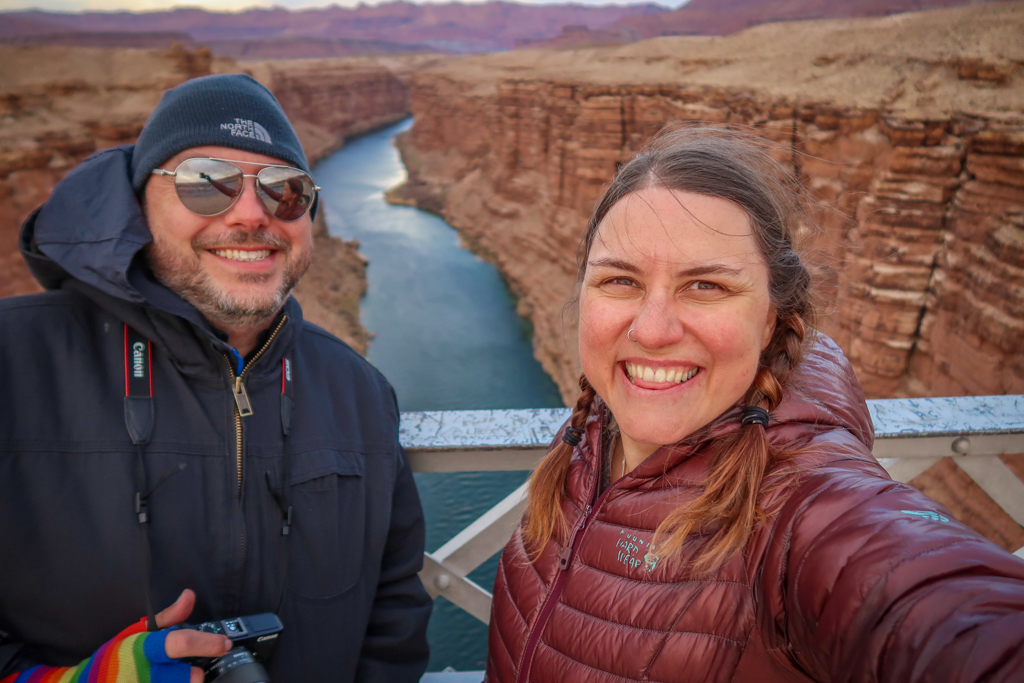 Photo of the author and her husband standing on the Navajo Bridge over Marble Canyon which is 470 feet tall.