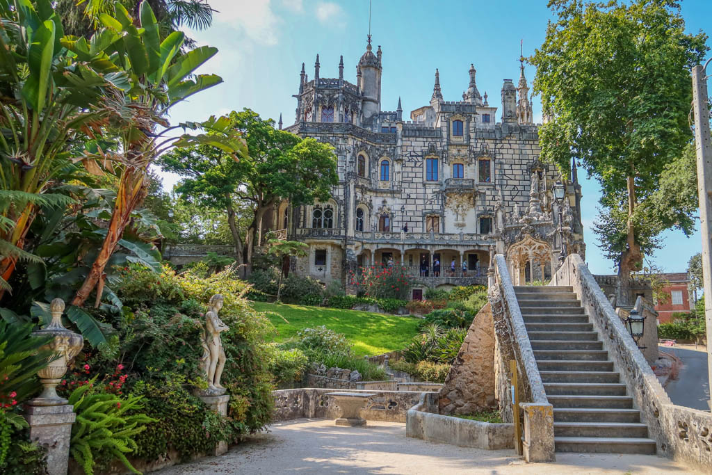 Steps lead to Quinta da Regaleira which is adorned with ornate fixtures and gothic spires