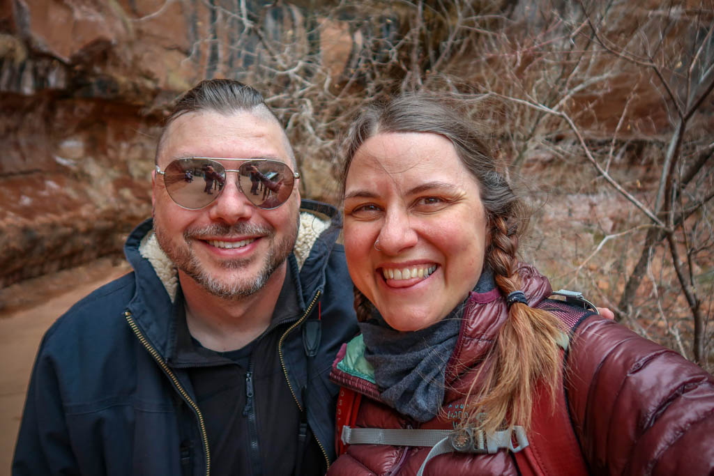 Photo of Daniel and the author standing on the trail by the Lower Emerald Pool in Zion 
