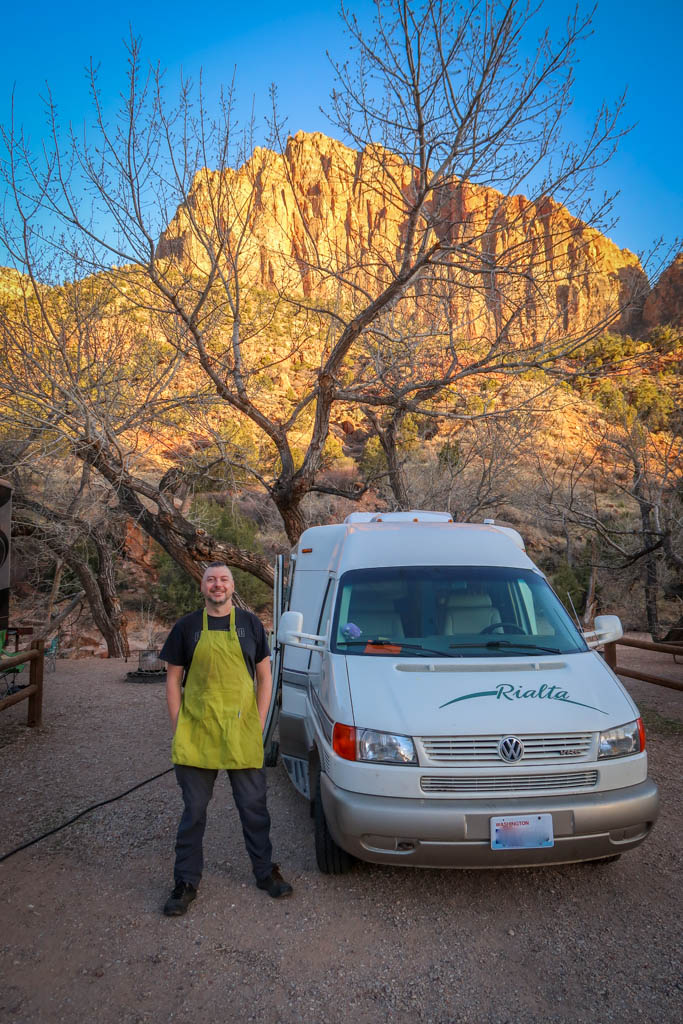 Our Rialta Motorhome is parked at a campsite right by the Virgin River with Zion Canyon in the background