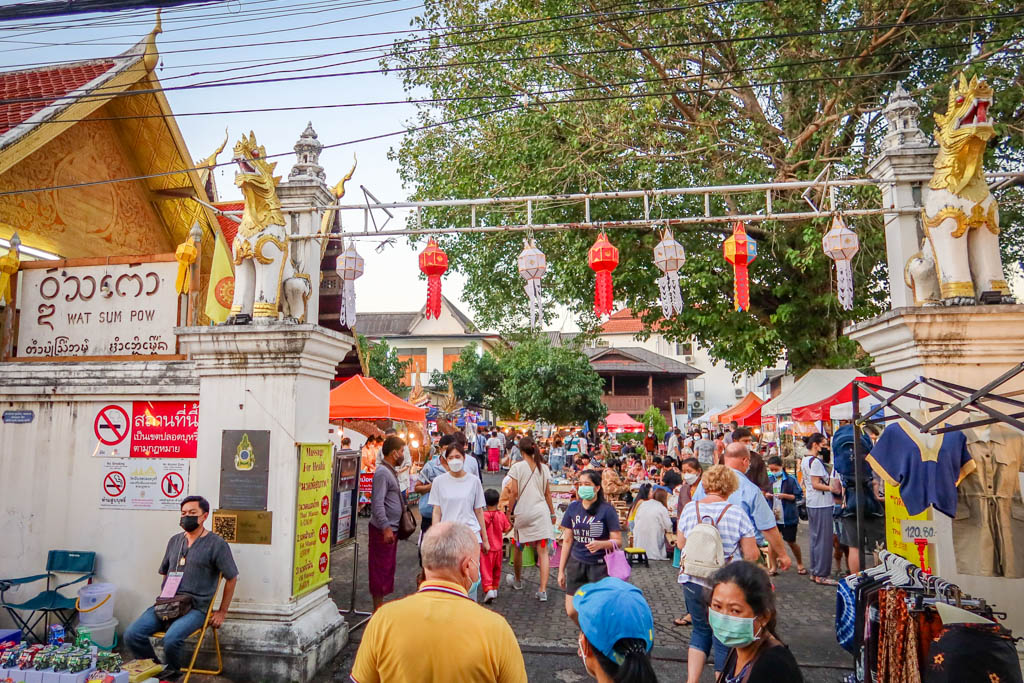 The outside of Wat Sum Pow temple is transformed into an outdoor food hall during Chiang Mai Sunday Market
